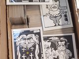 a cardboard box full of comics and stickers on it