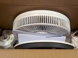 a box with a fan inside of it that is open
