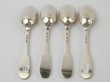 four spoons and a spoon rest on a white surface