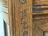 a close up of a wooden table with a sign on it