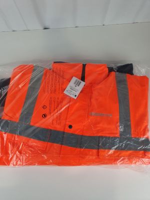 an orange safety vest sitting on top of a plastic bag
