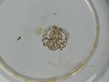 a white plate with a picture of a lion on it