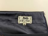 the label on the back of a black suit with gold buttons