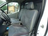 the interior of a van with the door open and the driver ' s seat up