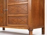 a wooden cabinet with a door and drawers on top of it