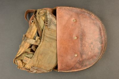 an old baseball mitt with a glove inside of it on a table