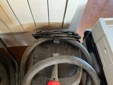 an image of a vacuum cleaner with a hose next to it