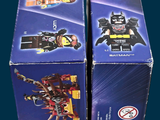 two boxes of lego batman movie minifigurnes on a blue background