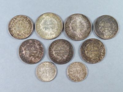 six different types of coins on a white surface