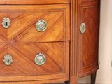 a dresser with a marble top in a room