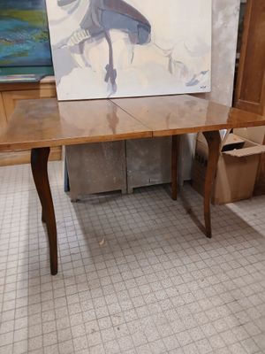 a table with a painting on it in a room