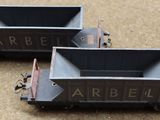 two toy train cars that are sitting on the ground
