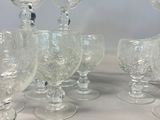a lot of empty wine glasses sitting on a table