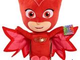 the stuffed animal is wearing a red costume and wings