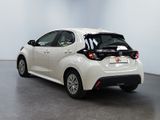 the rear end of a white toyota prius parked in a white room
