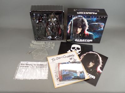 a box of action figures sitting on a table