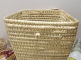 a basket that is sitting on a table next to other items
