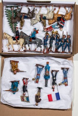 a box of toy figurines that are in a box