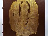 an image of a brown book with a gold design on the cover