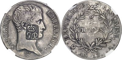 a close up of a coin on a white surface