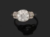 a diamond single - stone ring,