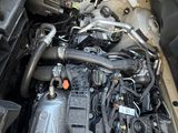 the engine of a car with its hood open and the hood down
