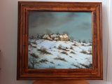 une photo d'un tableau accroché au mur au-dessus d'un tabouret
