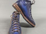 pair of men ' s blue leather boots with laces on them