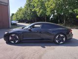 a picture of a black sports car parked in a parking lot