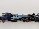 a lot of toy trains that are lined up in a row