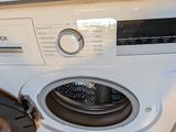 a washing machine that is sitting on the floor