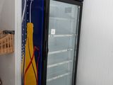 a blue and yellow vending machine in the corner of a room