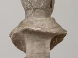 marble bust of a young man on a pedestal on a table