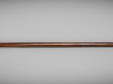 an old wooden stick with a wooden handle on a white background