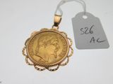 a close up of a gold coin with a price tag on it