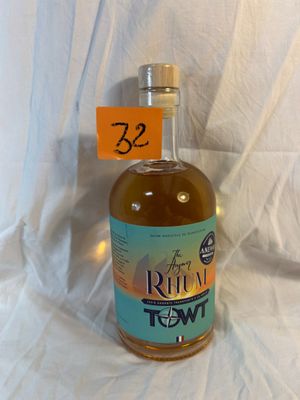 a bottle of rum in front of a white background