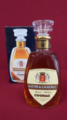 a bottle of liquor sitting on a table next to a box of liquor