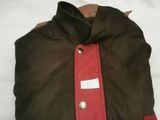 a brown and red bag on a white surface