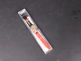 a red toothbrush sitting on top of a black table