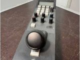 a remote control sitting on top of a wooden table
