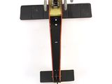 underside view of a model airplane on a white surface