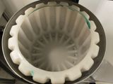 a metal pan that has a white cake inside of it