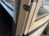 a close up of a door handle on a bus