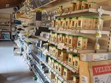 many shelves in the store that have various items on them
