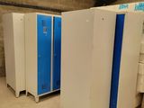 three blue and white lockers in a room