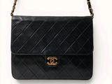 a chanel black quilted leather shoulder bag with gold hardware