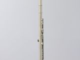 a silver pen sitting on top of a white pedestal