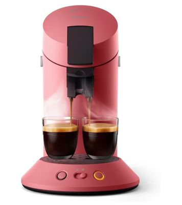 une image représentant une cafetière rose avec deux tasses de café
