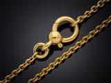 a gold chain with a clasp on a black background