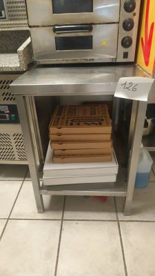 an image of a commercial pizza oven with pizzas in it